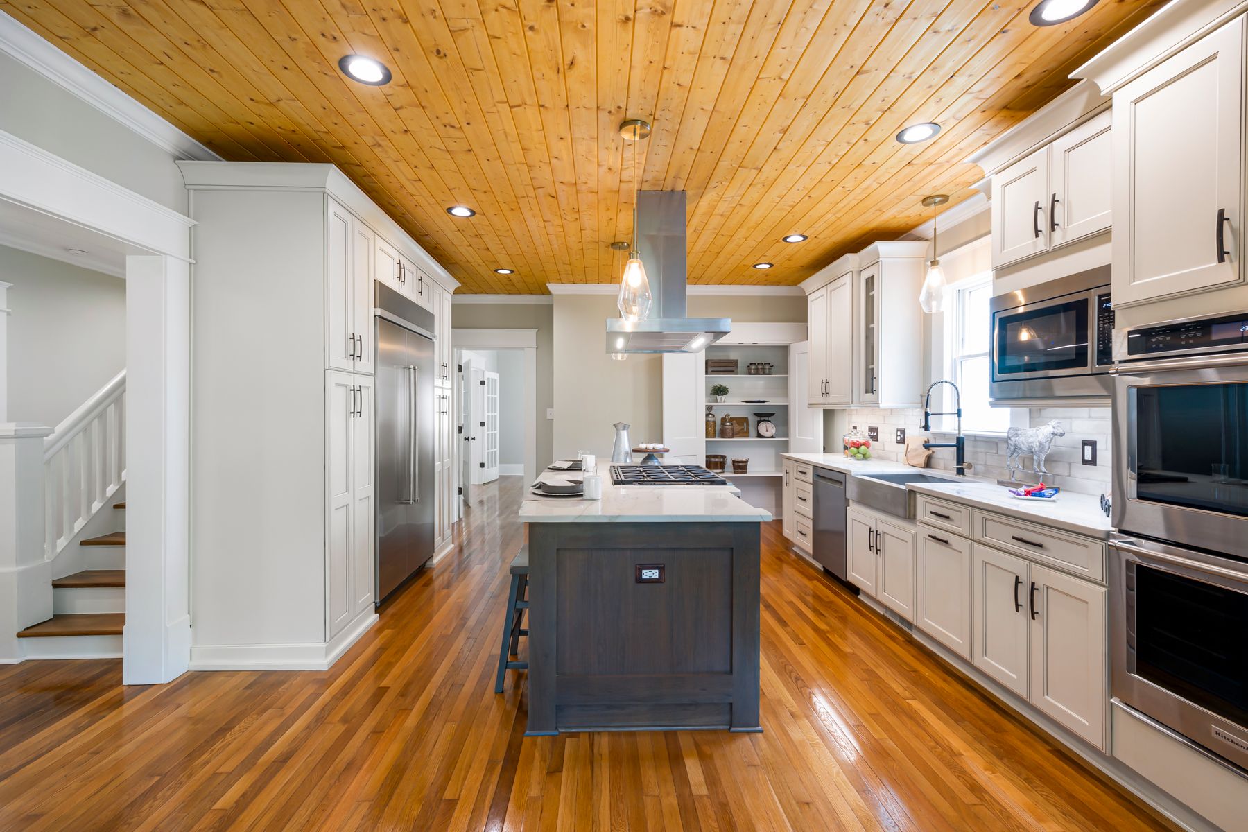 A completed modern kitchen with clean cabinetry and organized finishes